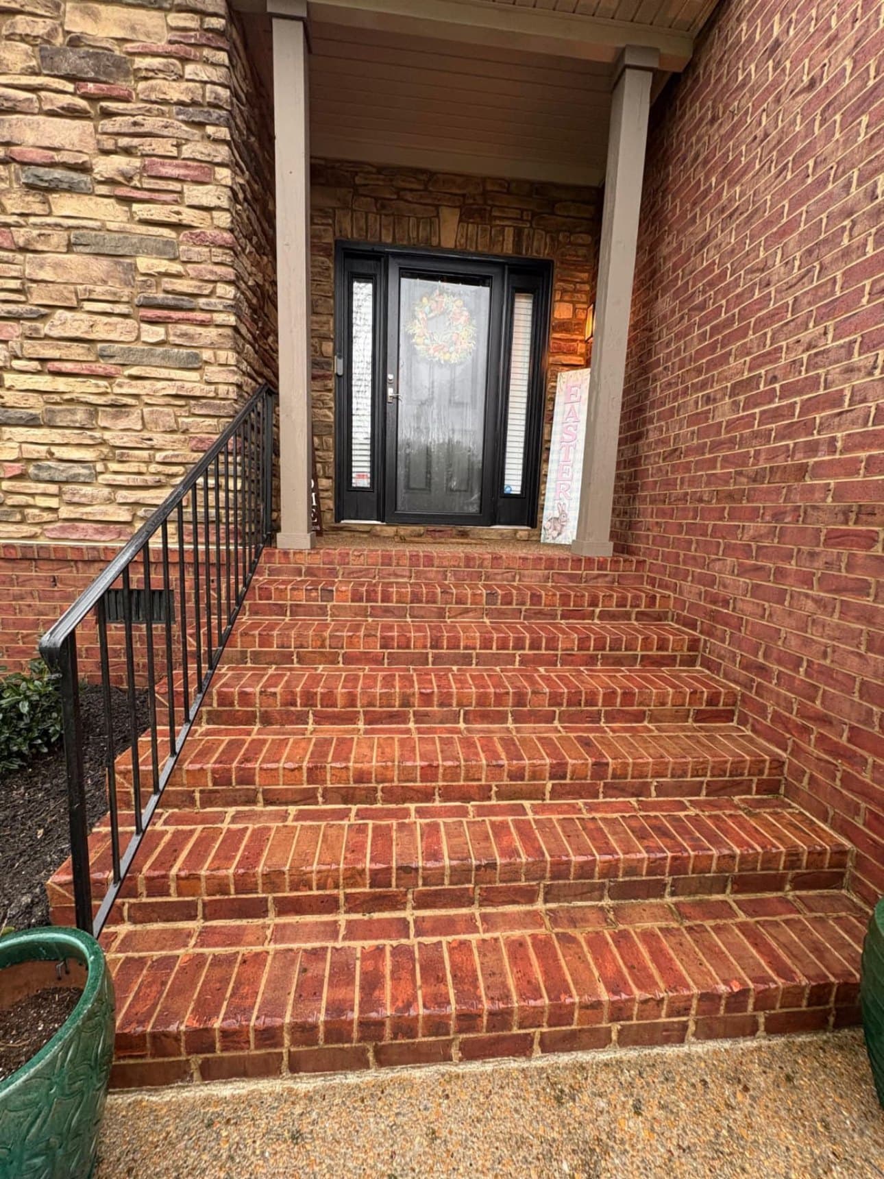 Red brick front steps and stone entryway cleaned back to an even colour